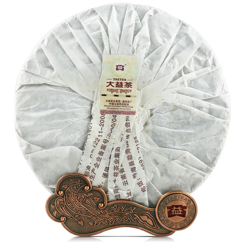 Dayi Tea 2012 Pu'er tea cake wrapped in conventional tissue paper packaging for commercial use