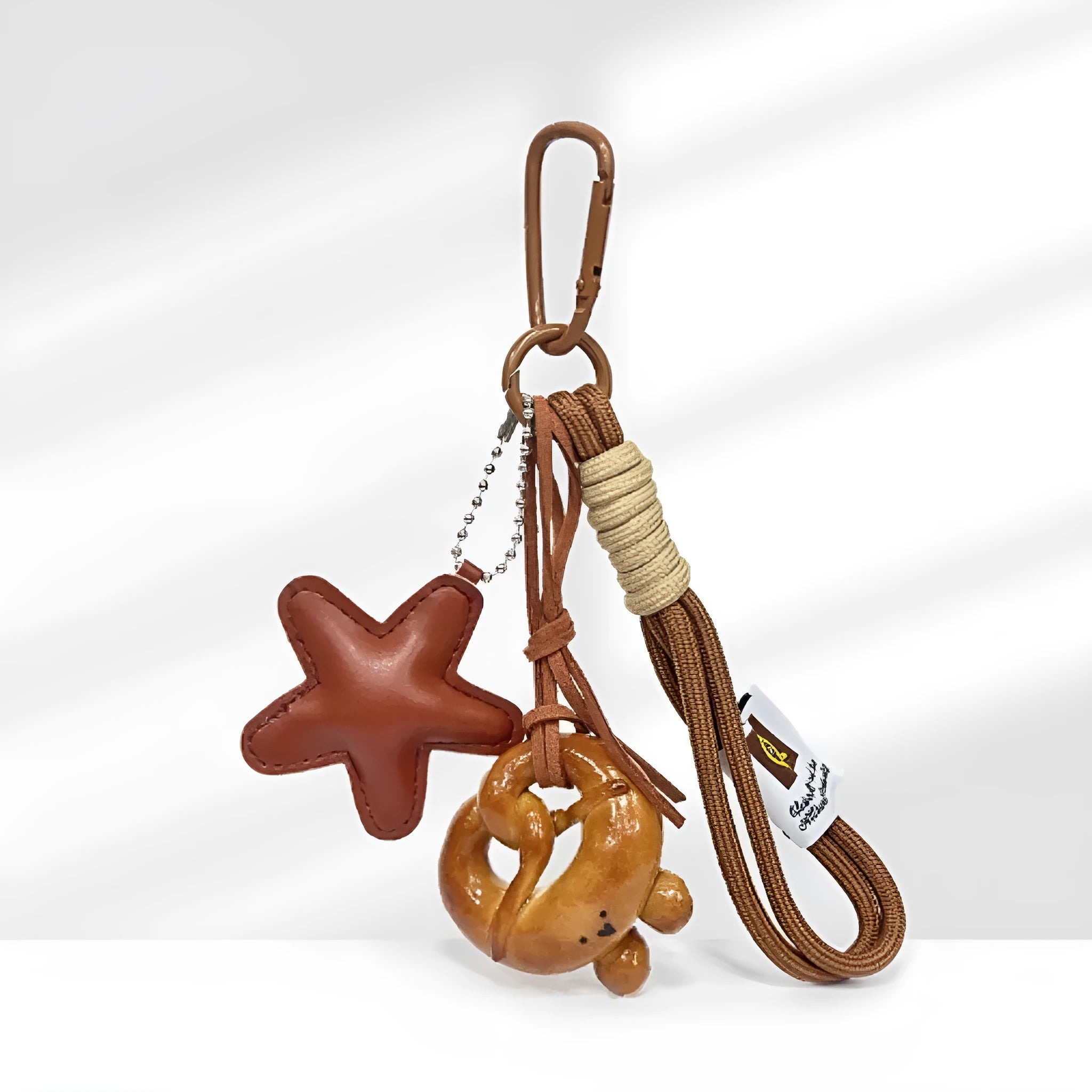 Handmade soda bread handbag pendant with baking varnish treatment showing five creative designs