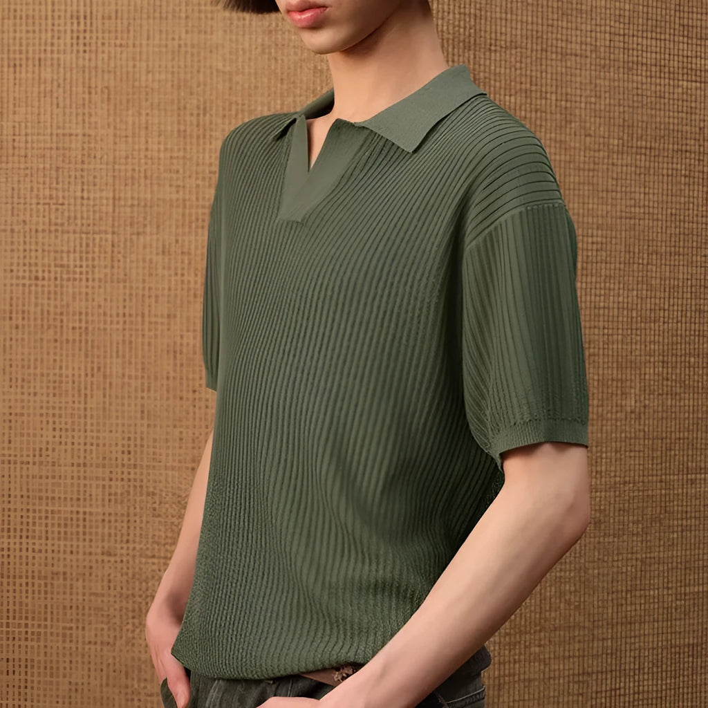 Man wearing a creamy white striped loose fit short sleeve polo shirt made from ice silk fabric.