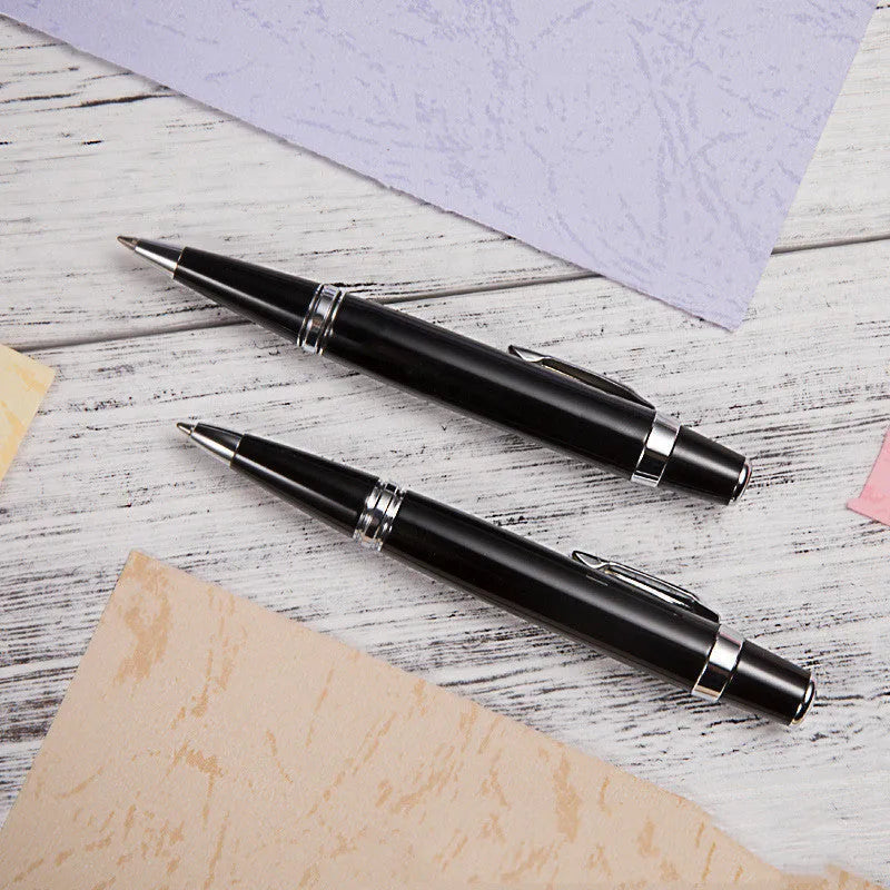 Short black metal ballpoint pen with rotating mechanism showing 112mm length and 12.5mm diameter