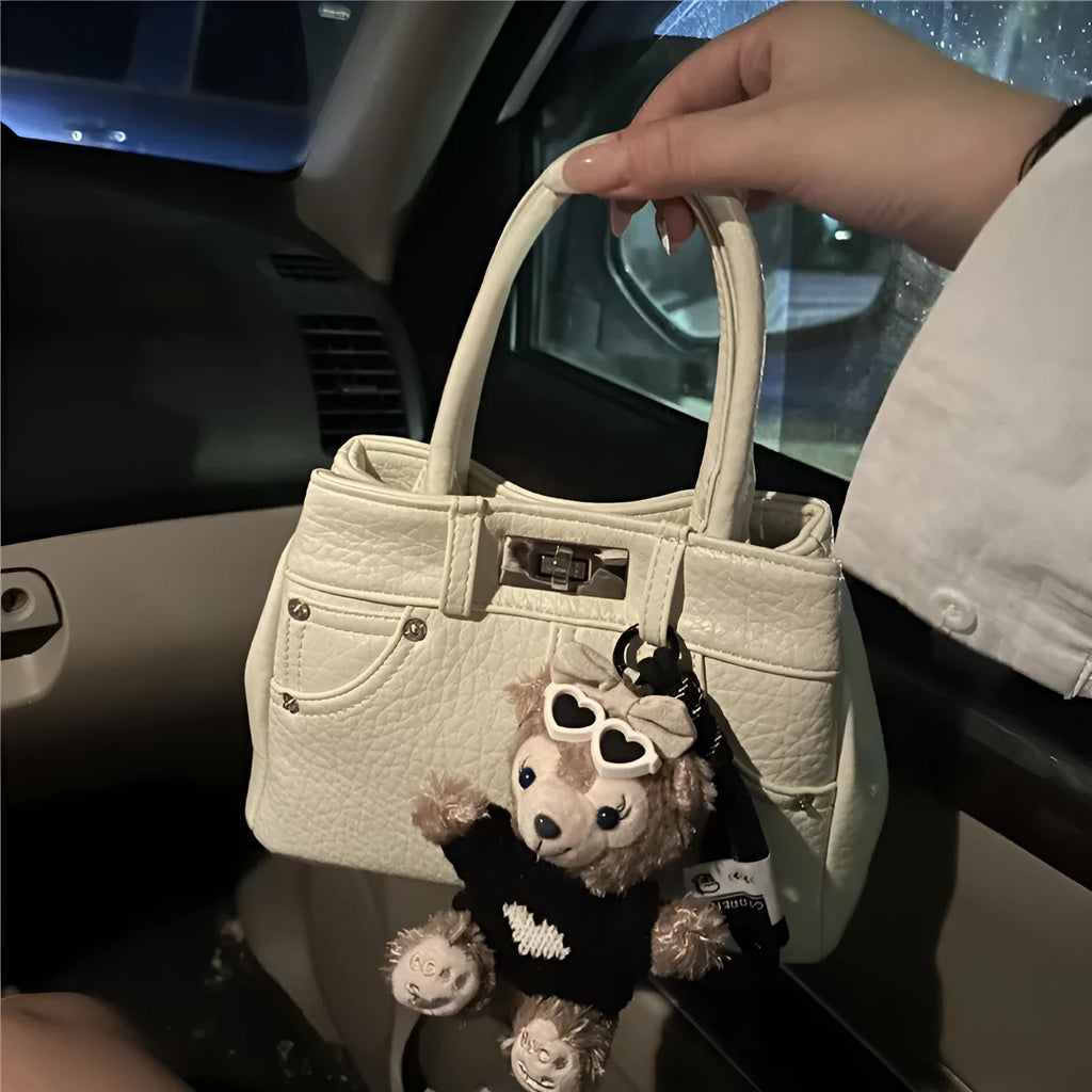 Women's casual denim blue PU shoulder handbag with standard size and polyester lining