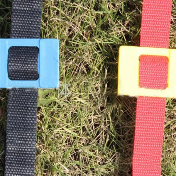 PP jump ladder in black laid flat on grass for foot basket training