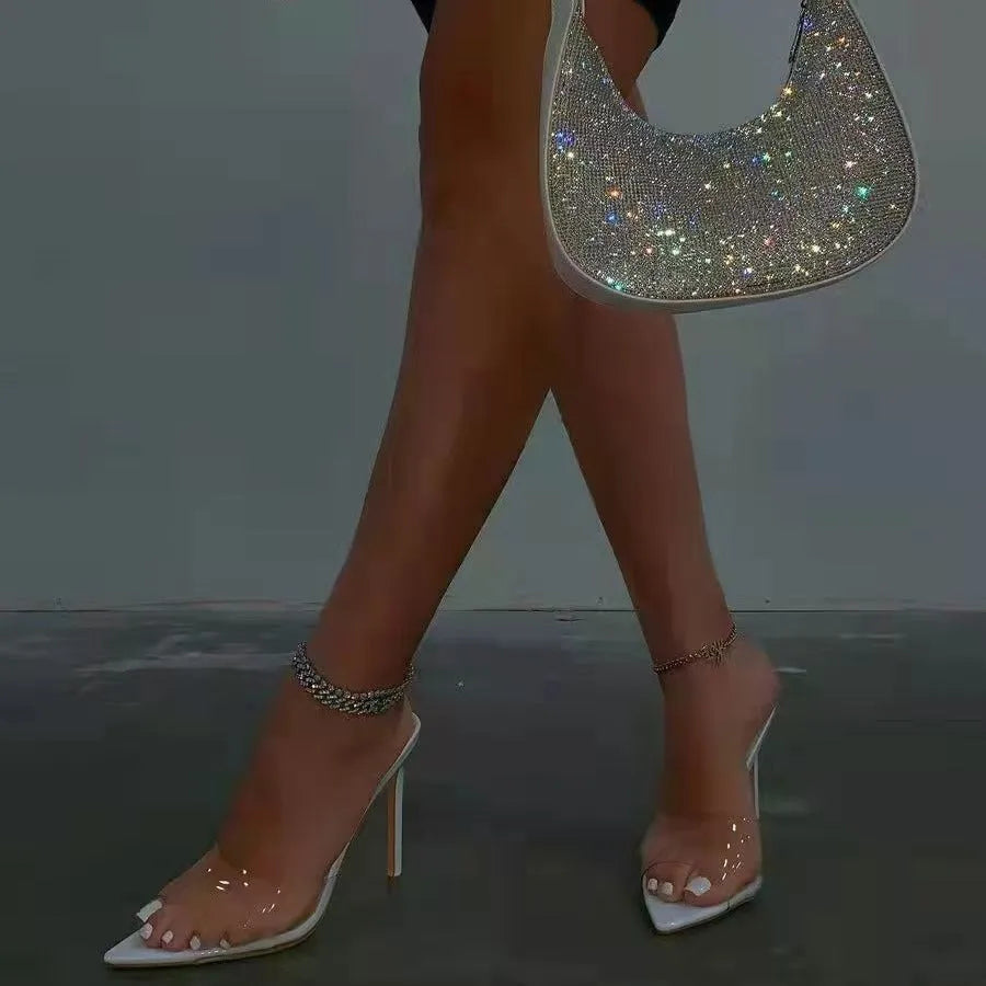 Women's black ultra-high vamp stiletto heel slippers with pointed toe and rubber sole.