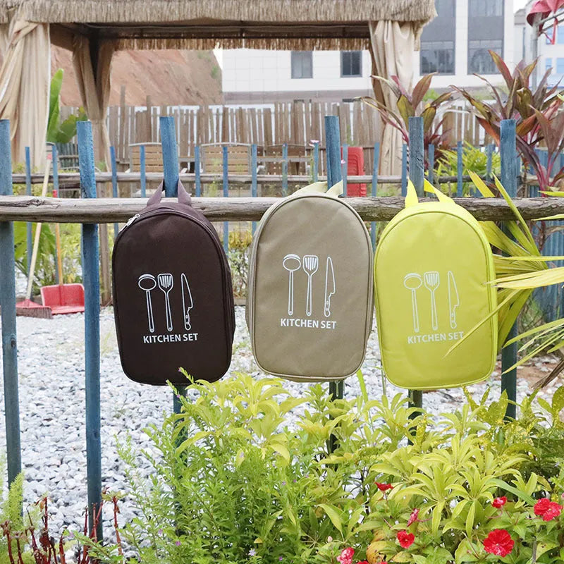 Multi-functional portable picnic bag containing a 12-piece stainless steel kitchenware set for outdoor dining.