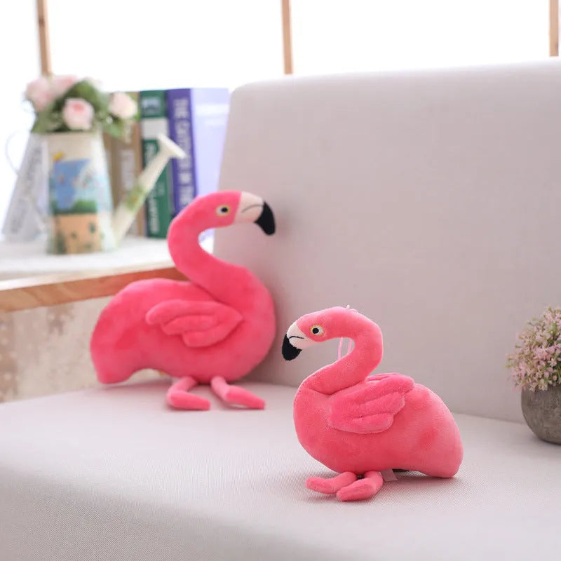 Pink flamingo plush toy with short plush fabric, filled with PP cotton, sitting on a surface