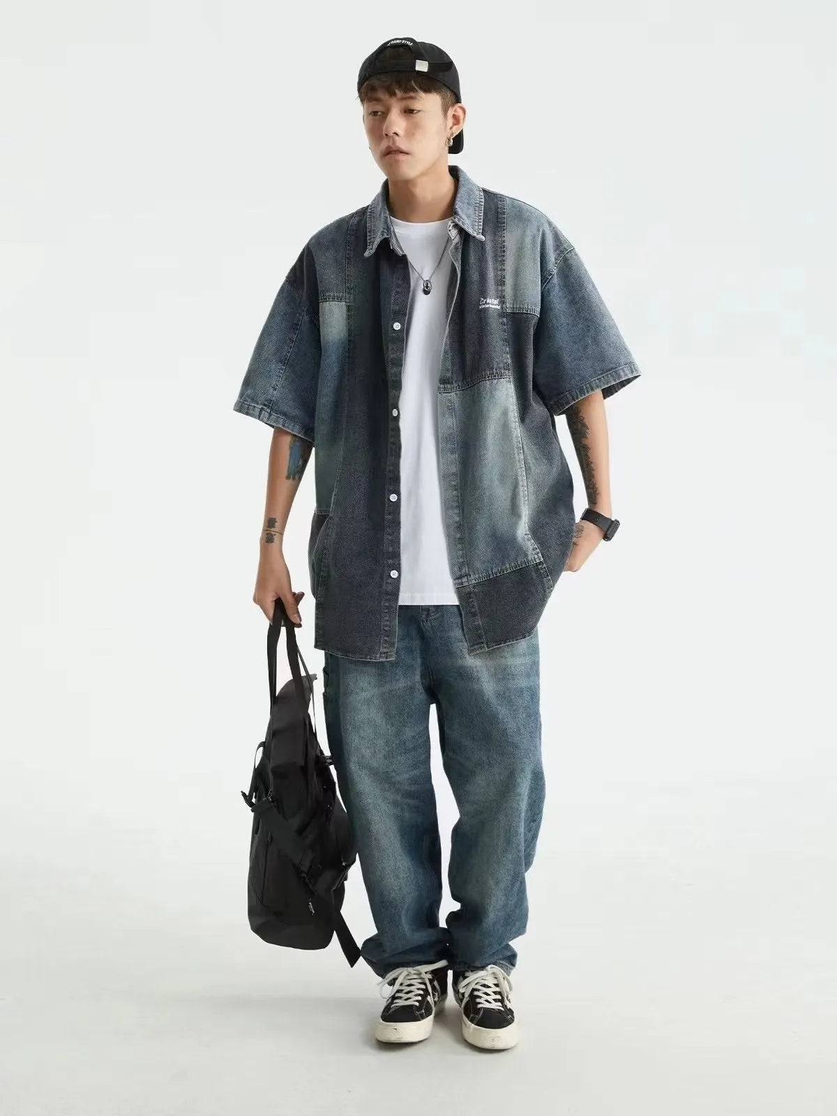 Blue men's loose-fit denim shirt with Japanese retro washed stitching, shown open in a cardigan style.
