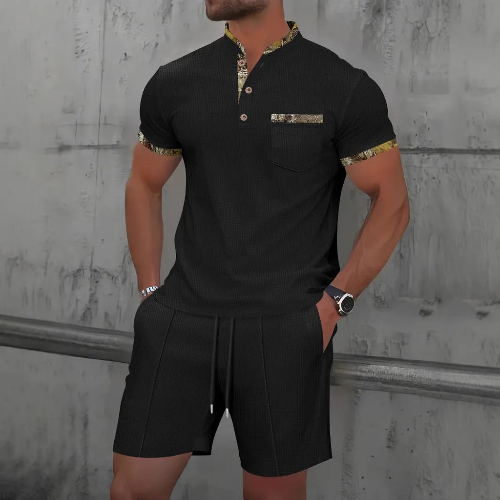 Man wearing a grey waffle texture short sleeve zip-up jacket and matching shorts from the suit set.