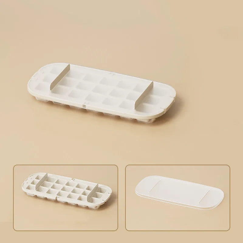 Yellow high-capacity silicone ice cube tray with lid, showing the grid of 1 cm cubes and the ice shovel stored in its slot.