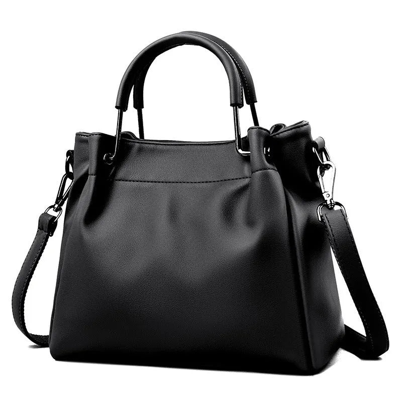 Leisure soft leather bucket bag in black with slit pocket and visible sewing thread detail for commuting