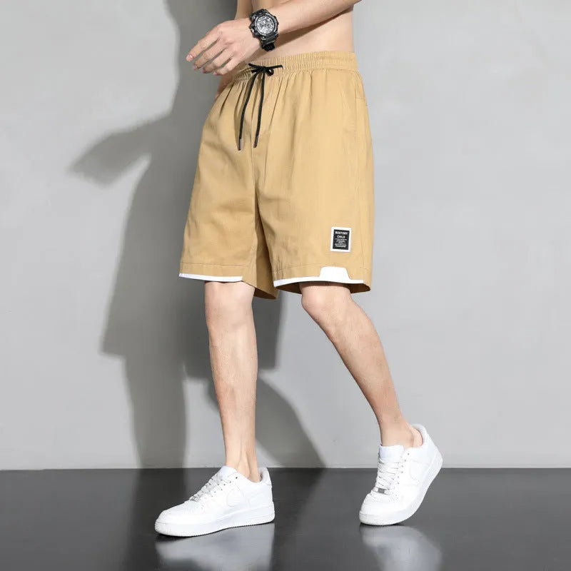 Boy wearing khaki cotton shorts with mid-waist, showing front view.
