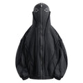 Man wearing a black retro-style zip-front cotton hooded coat with abstract pattern.