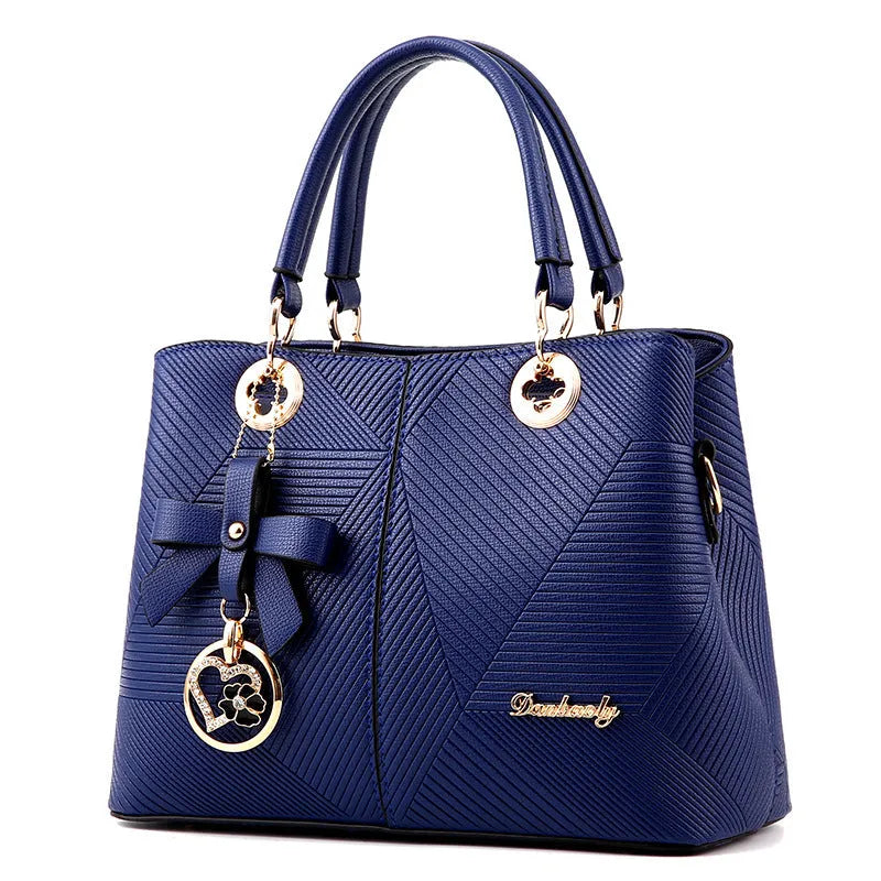 Retro style PU handbag in multiple colours showing zip opening and adjustable shoulder strap