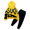 A boy wearing a black Korean-style hooded cotton tracksuit set with a letter print, featuring long sleeves and matching trousers.