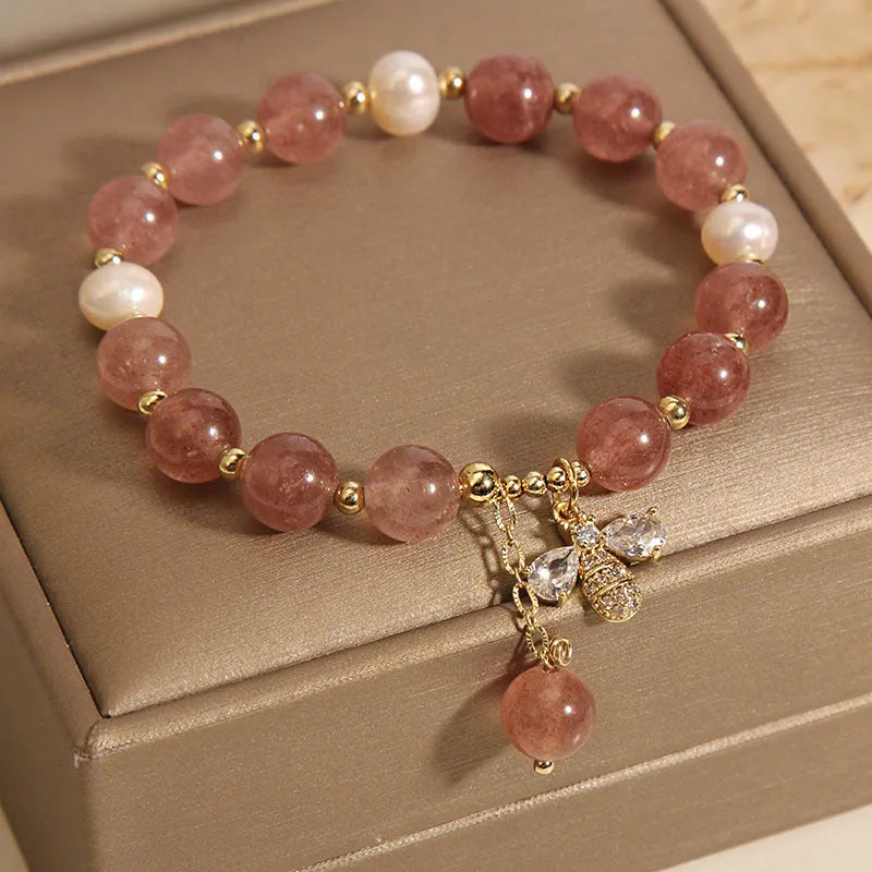 Women's bracelet with strawberry quartz stones, freshwater pearls, and zircon on an alloy chain.