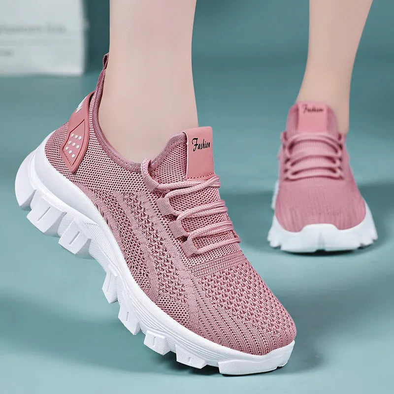 Women's Flyknit sneakers with thick PVC sole in beige colour showing lace-up front and round toe design