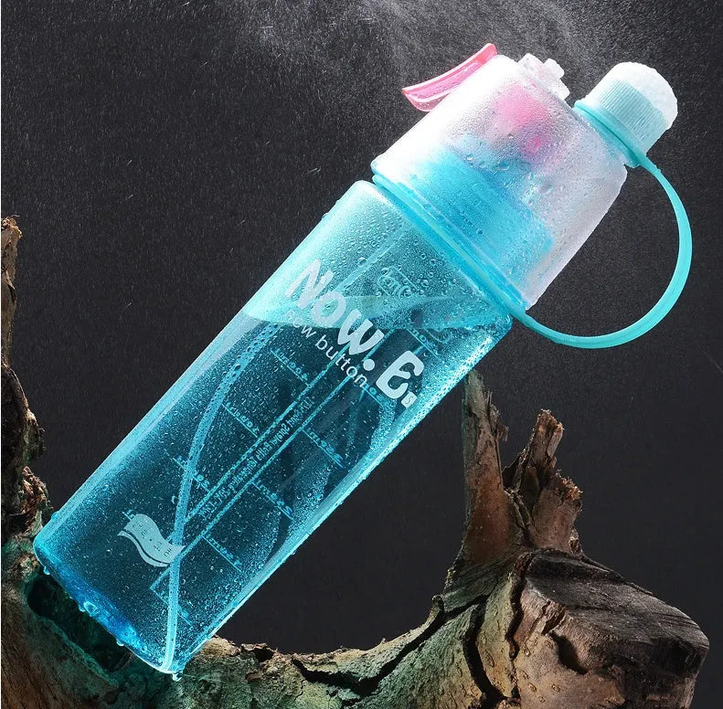 Green portable sports mist spray cup with handle, leakproof lid, and visible scale, shown next to a black version.