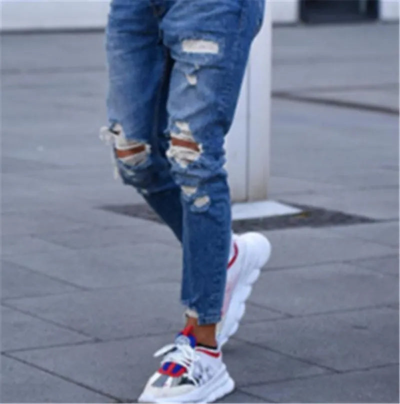 Men's deep blue hole distressed jeans in cotton fabric showing six available sizes