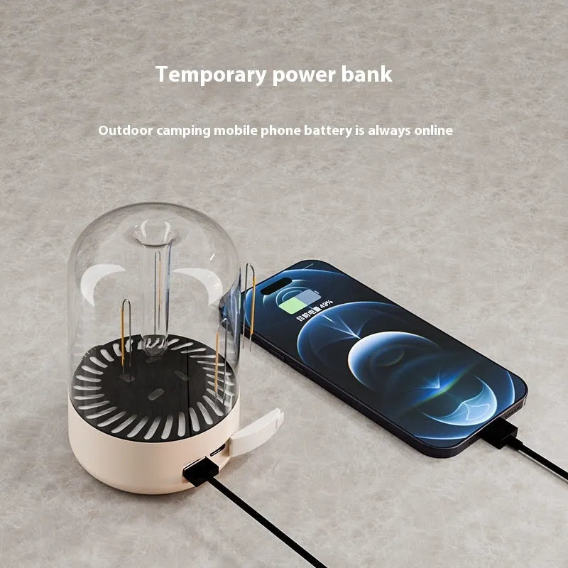 Beige and black rechargeable camping ambience light with control knob, shown with size scale.