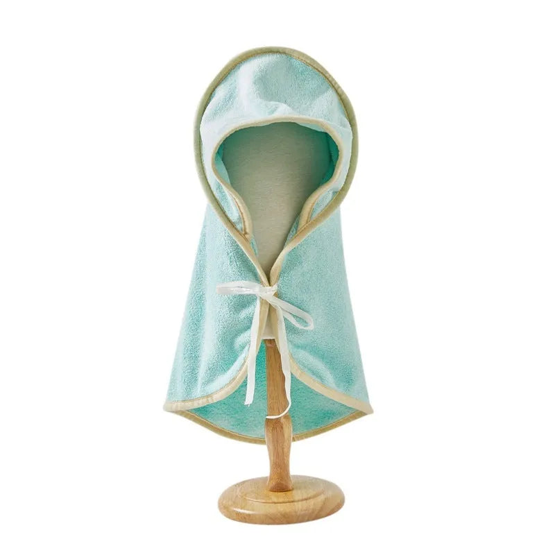 Microfiber pet quick-drying bathrobe in beige, folded on surface