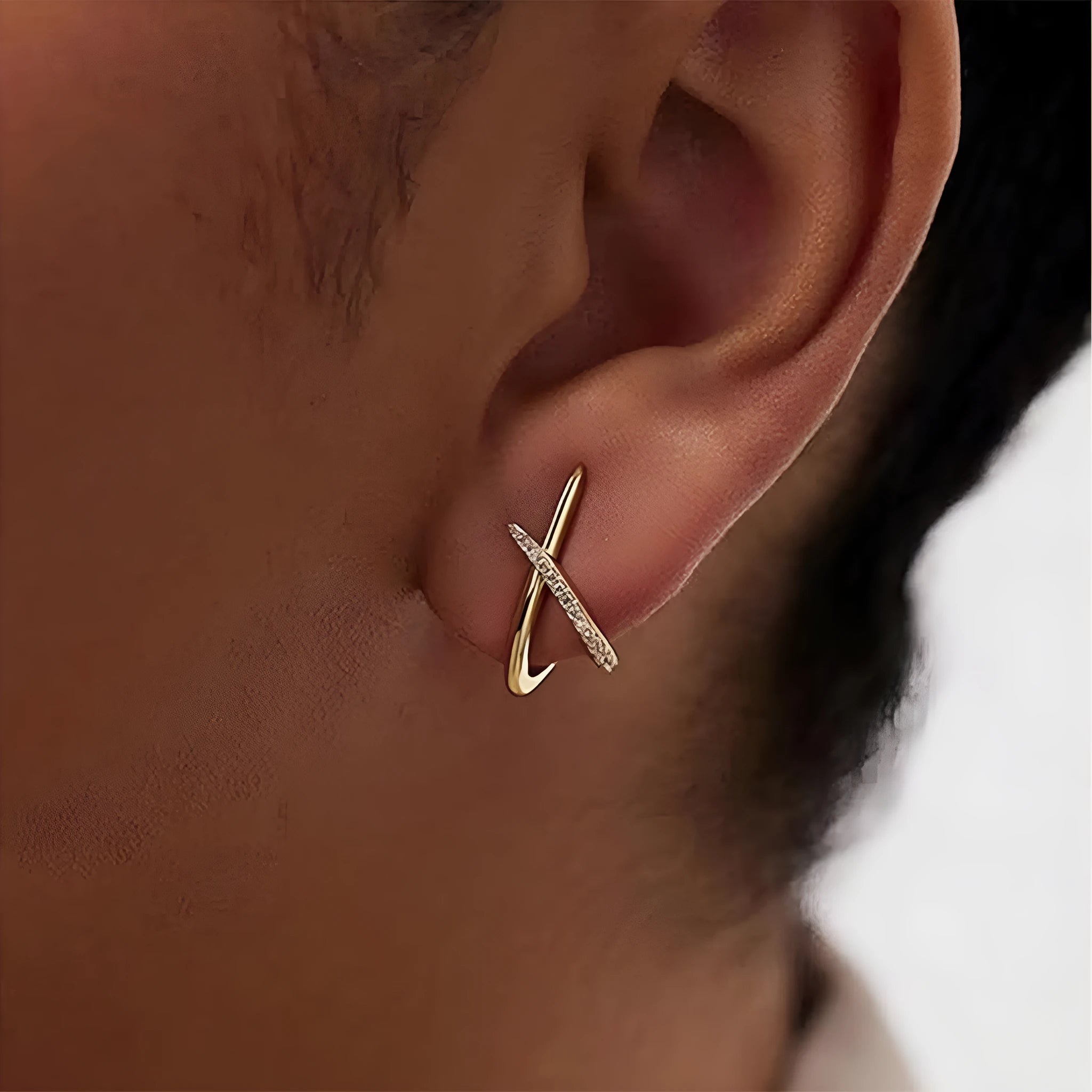 Electroplated 14K gold geometric clip earrings in gold finish on white background