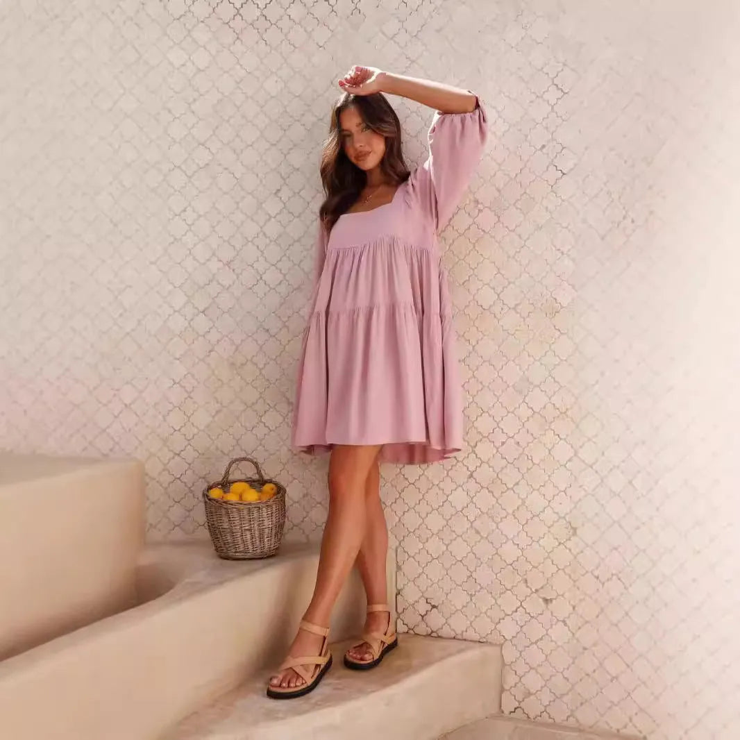 Light blue square collar puff sleeve backless A-line dress for a girl on a hanger.
