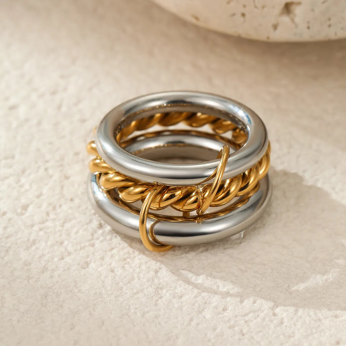 Stacked stainless steel rings with 18K gold plating in free size adjustable design