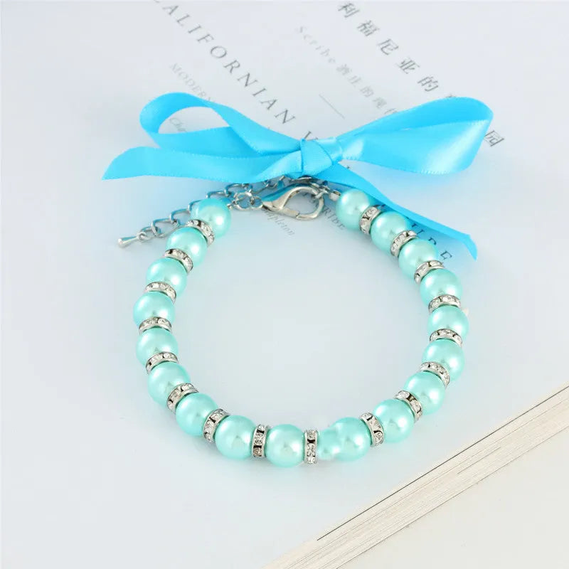 Adjustable dog pearl necklace with rhinestones on blue ribbon for small dogs
