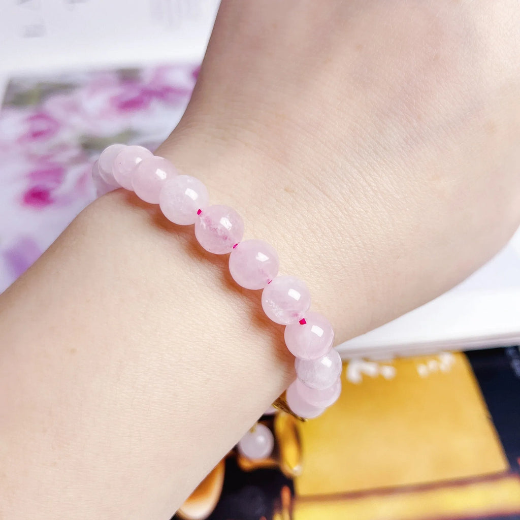 Pink Chinese crystal peach blossom bracelet with adjustable design on wrist