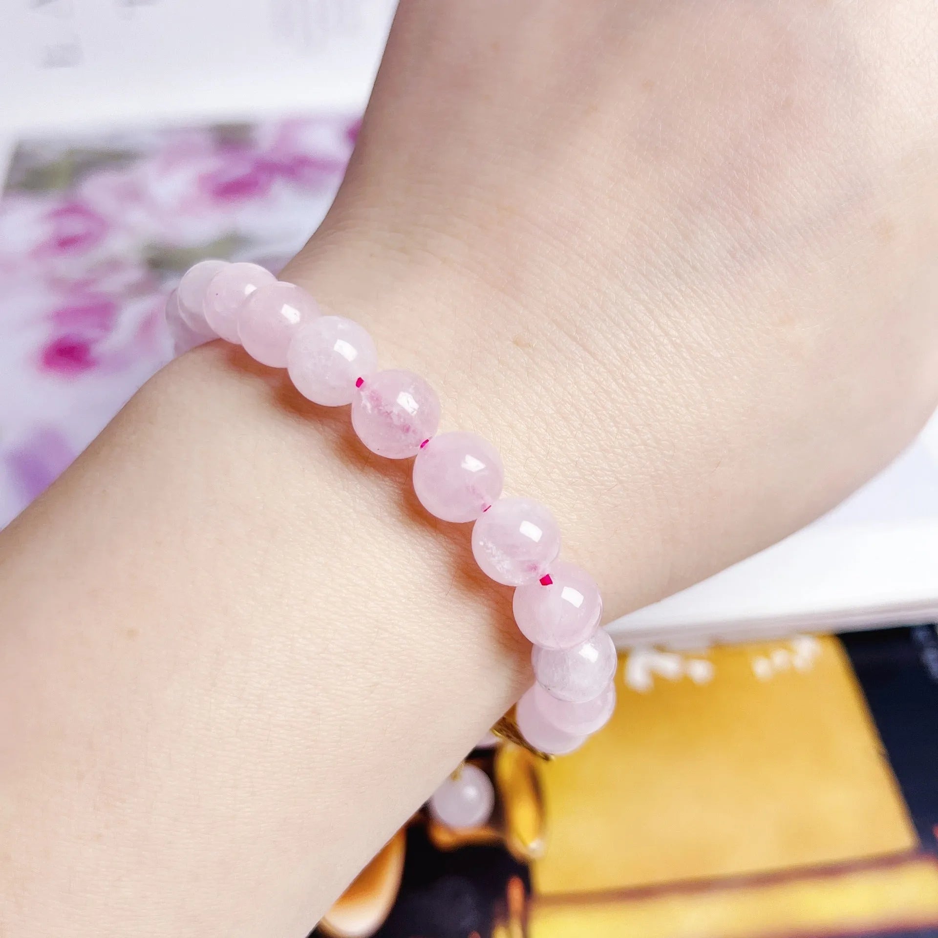 Pink Chinese crystal peach blossom bracelet with adjustable design on wrist