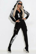 Black women's hooded casual suit with wings printing on the top, paired with matching trousers.