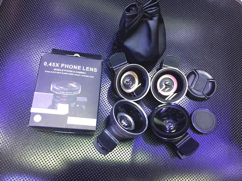 Mobile phone lens kit with wide angle, macro and fish eye lenses mounted on smartphone