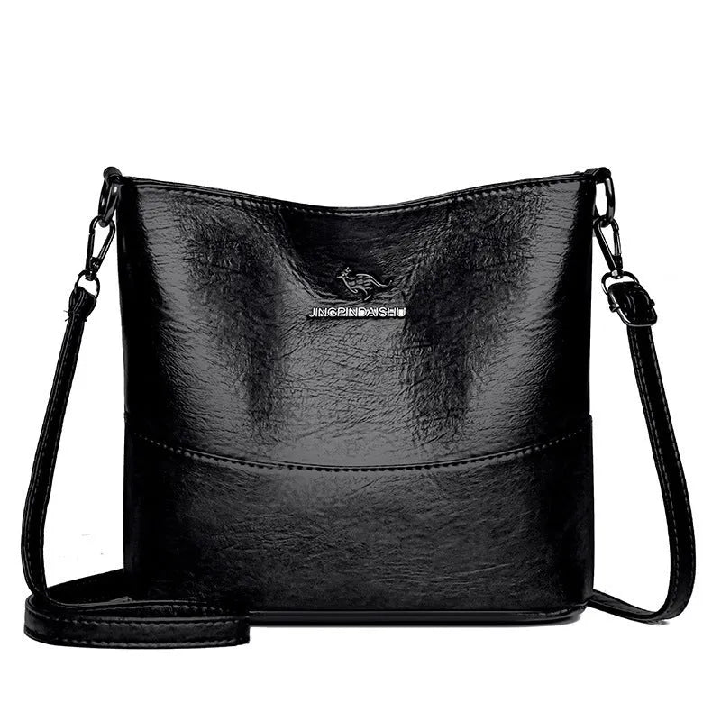 Women's soft leather bucket shoulder bag in black with sewing line detailing and mobile phone pocket