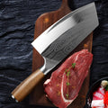Stainless steel kitchen knife with a 320mm forged blade on a cutting board.
