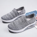 Women's casual running shoes with mesh and PU upper in beige, showing round toe and mid-heel design.