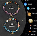 Two beaded elastic bracelets with natural stone zodiac beads on a wrist.