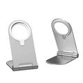 Silver vertical adjustable magnetic phone bracket for iPhone 12 on a car dashboard.