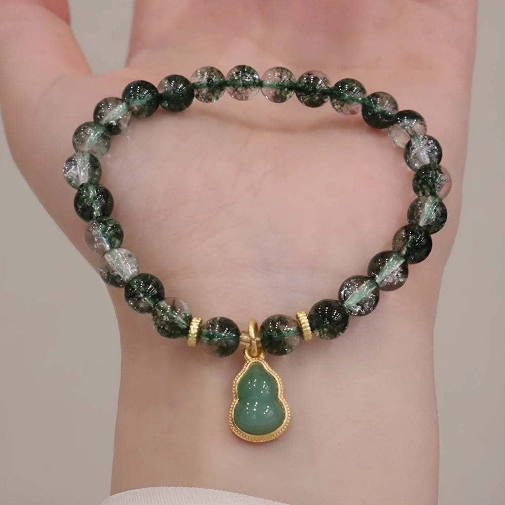 Women's crystal bracelet with green phantom quartz heart pendant and natural chorite details