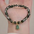 Women's crystal bracelet with green phantom quartz heart pendant and natural chorite details