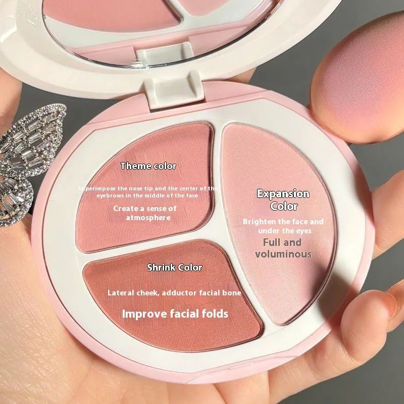 Tricolor blush palette showing three matte shades: peach, apricot, and mauve-pink