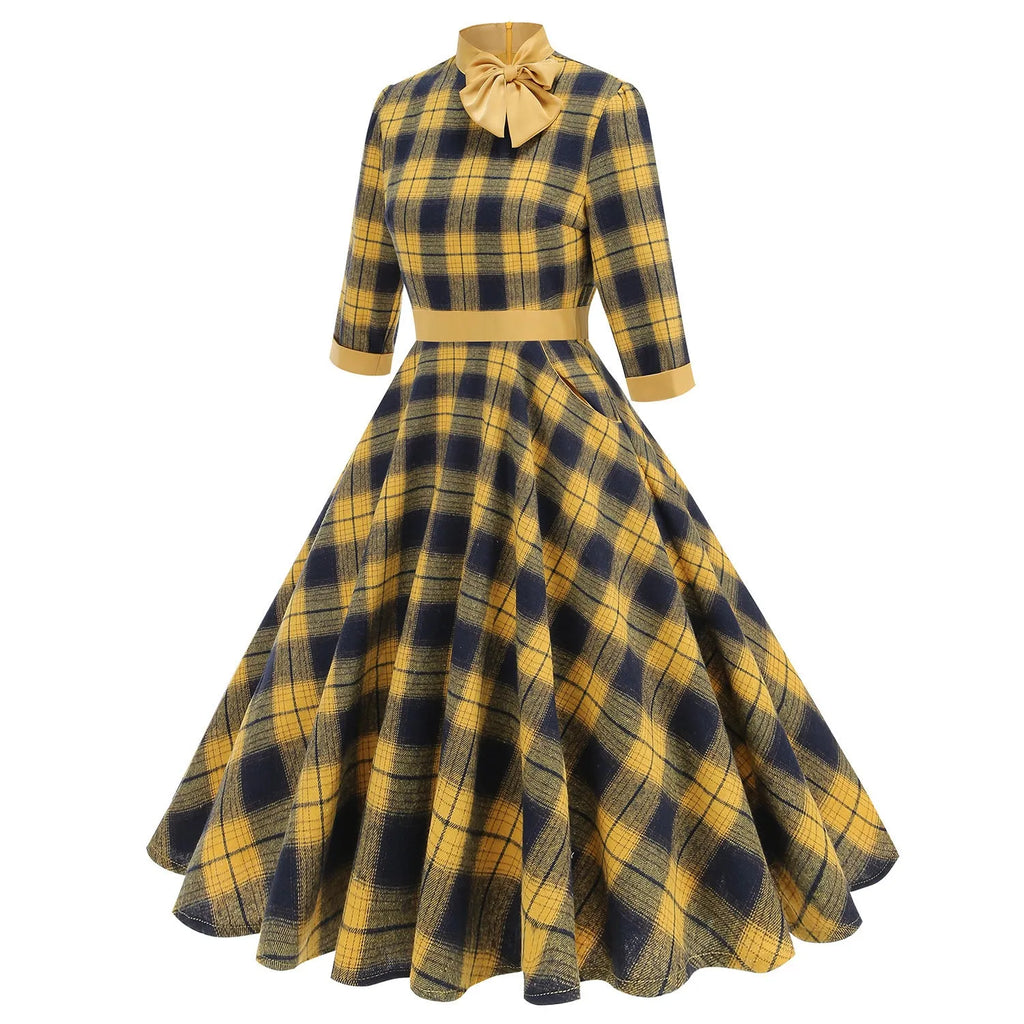 Yellow and black grid plaid turtleneck bow high waist swing dress on display showing full skirt and bow detail