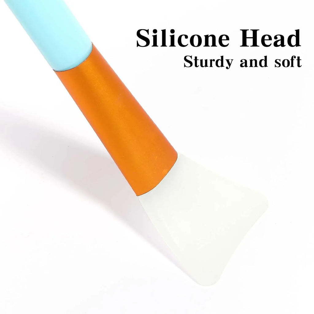 Reusable silicone face and body mask applicator spatula in six colours on a white background.