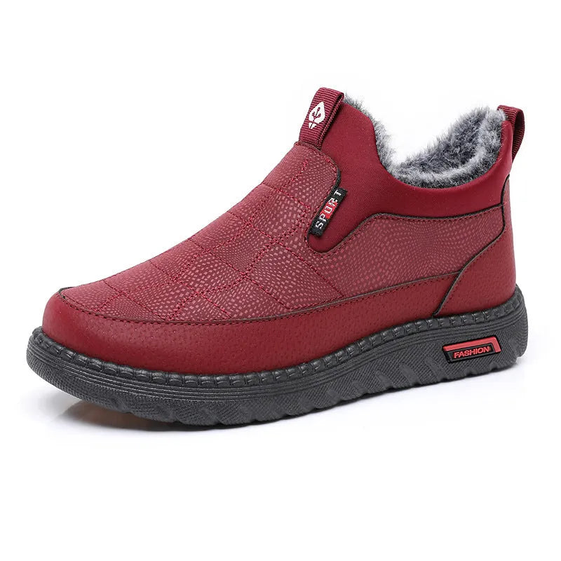 Women's black casual flat boots with a round toe and low-top synthetic leather upper.