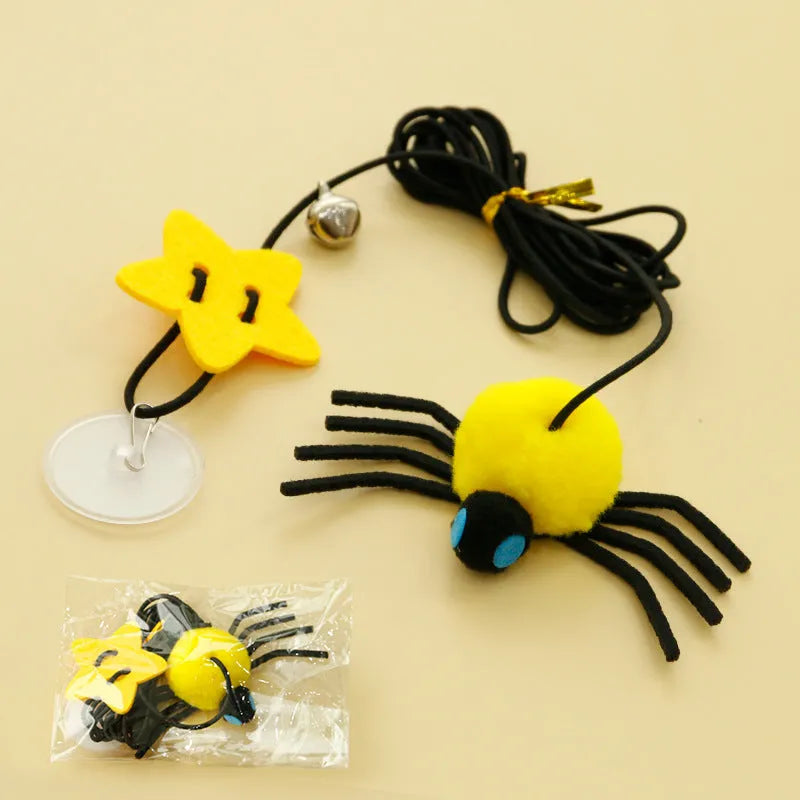 Red and yellow hanging cat toy with elastic rope, feather ball, bell and spider attachment for door mounting
