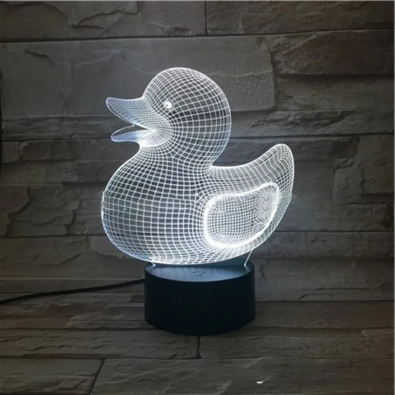 3D yellow duck shaped LED night light with remote control on a table