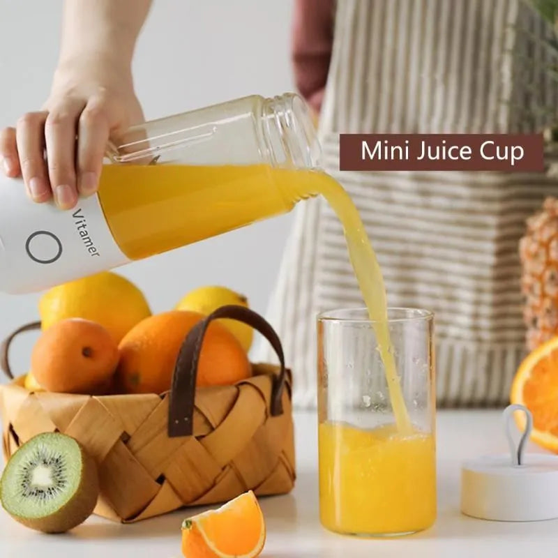 White portable USB blender with 350ml cup and silicone carry ring on a base.