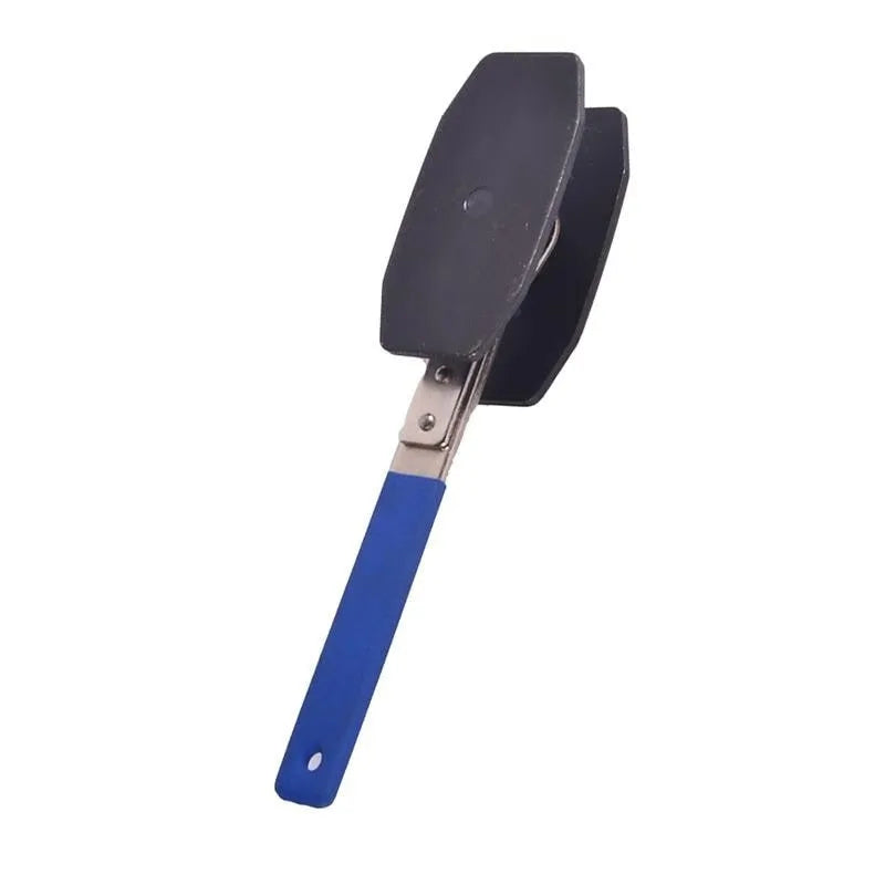 Black stainless steel brake caliper press with ratchet mechanism, 270mm length, on a workshop bench