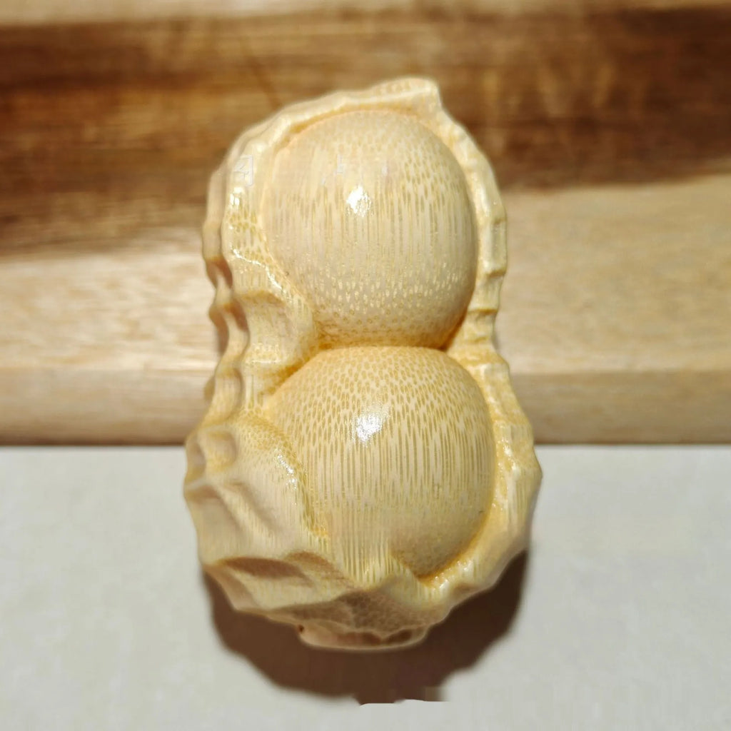 Natural solid bamboo peanut carving ornament with 'May Good Things Happen' inscription
