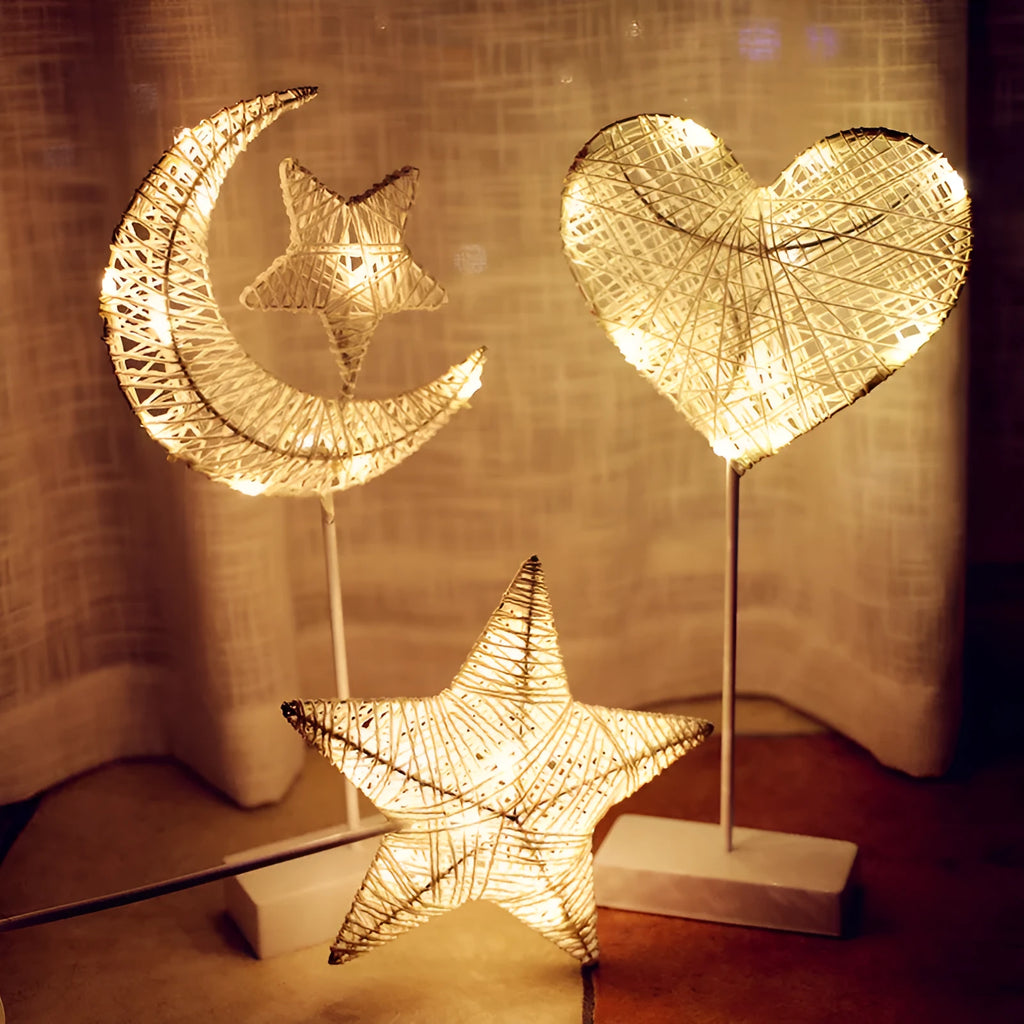Rattan and copper wire LED table lamp in star, heart, or moon shape for bedroom decoration.