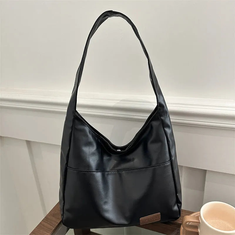 Women's retro large capacity PU bucket tote bag in Korean style with sewing thread detail, shown in coffee colour