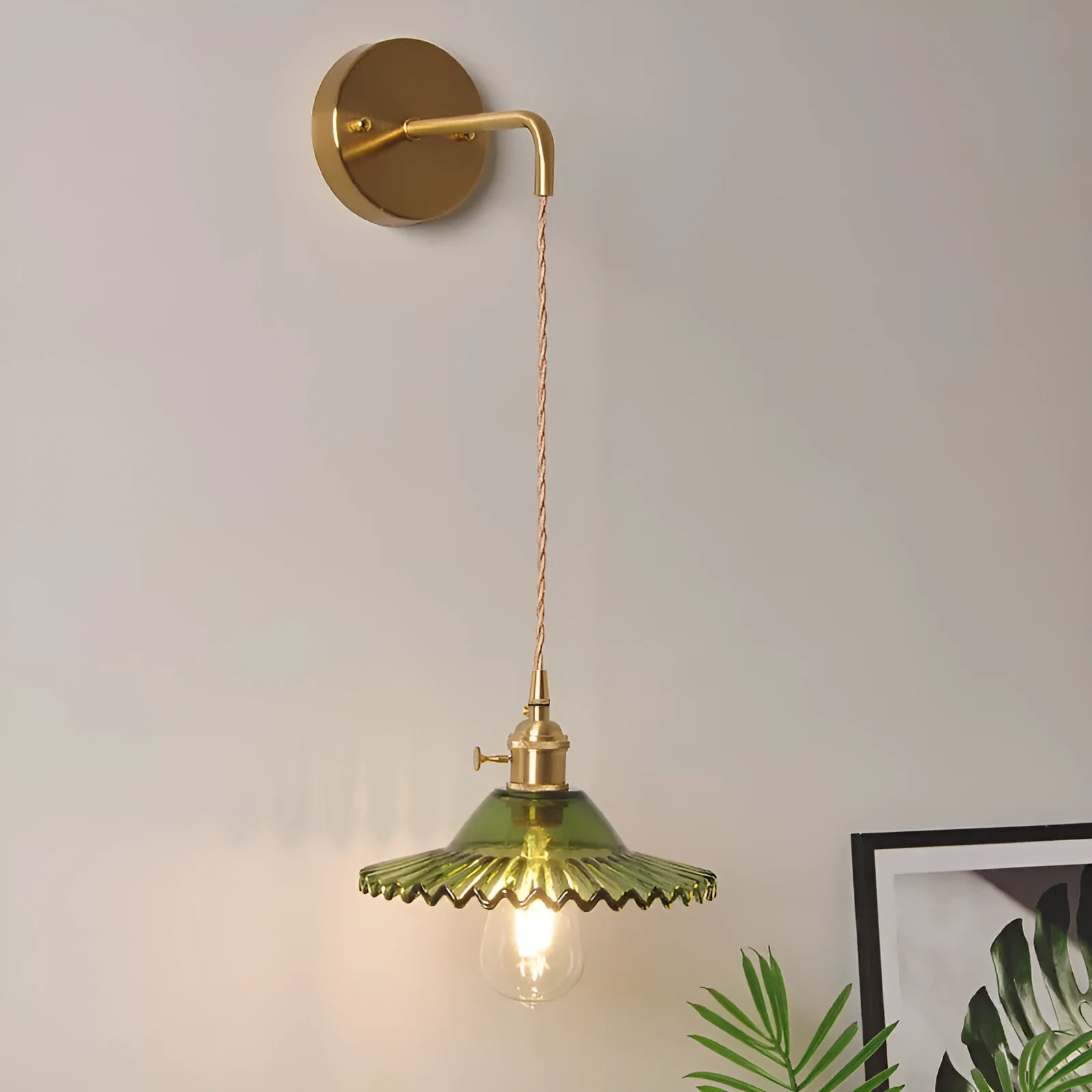 Retro brass lotus wall lamp with glass shade mounted on a wall, showing copper fittings.